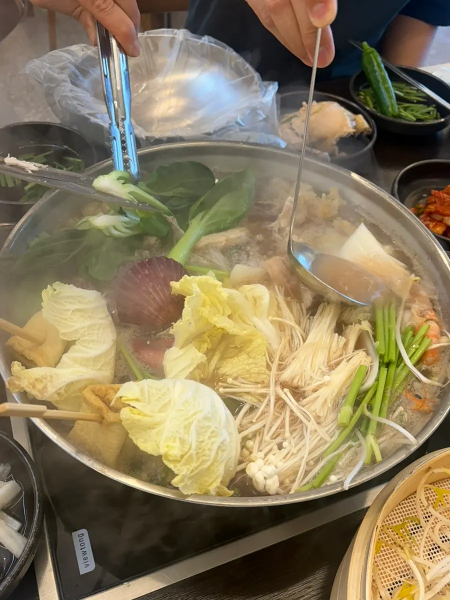 Broth with large chunks of octopus in the haesintang