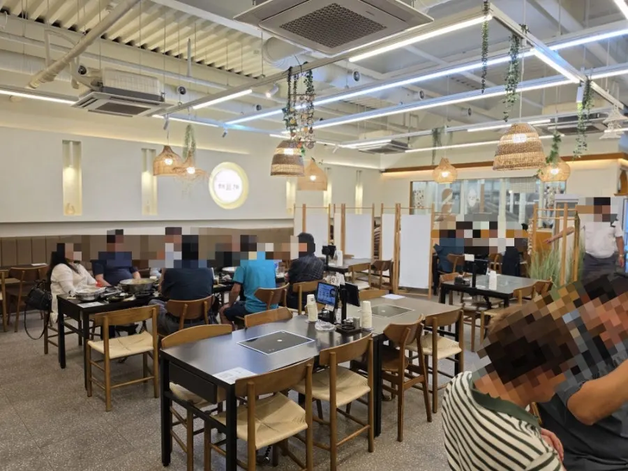 Interior of Haepumgye with customers on a weekday evening