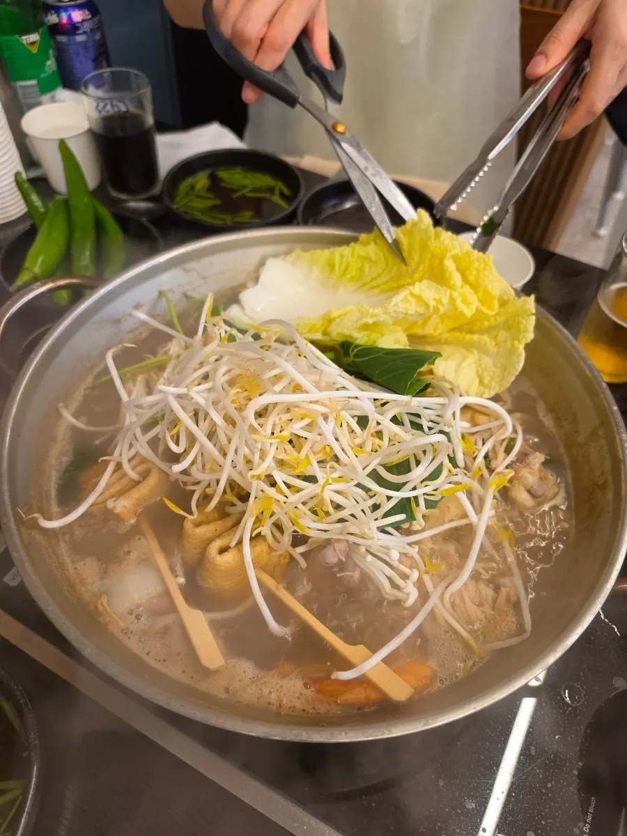 Haesintang pot with fish cakes and vegetables added