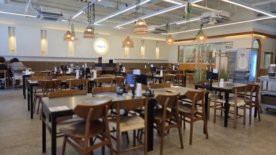 Dining hall interior with widely spaced tables