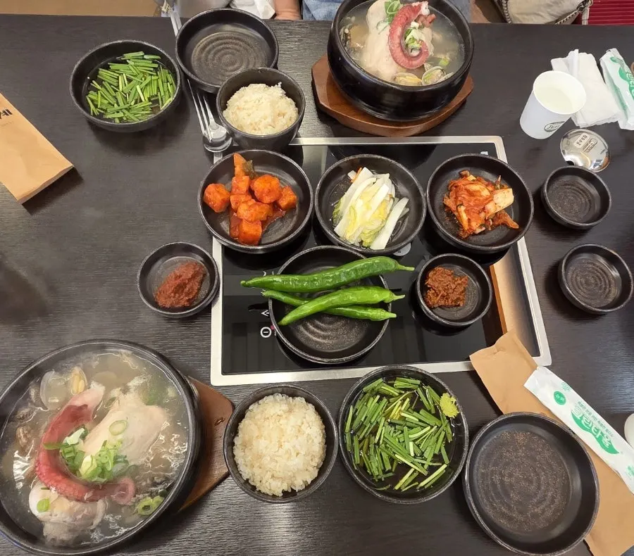 Chive sauce, white kimchi, and radish kimchi side dishes