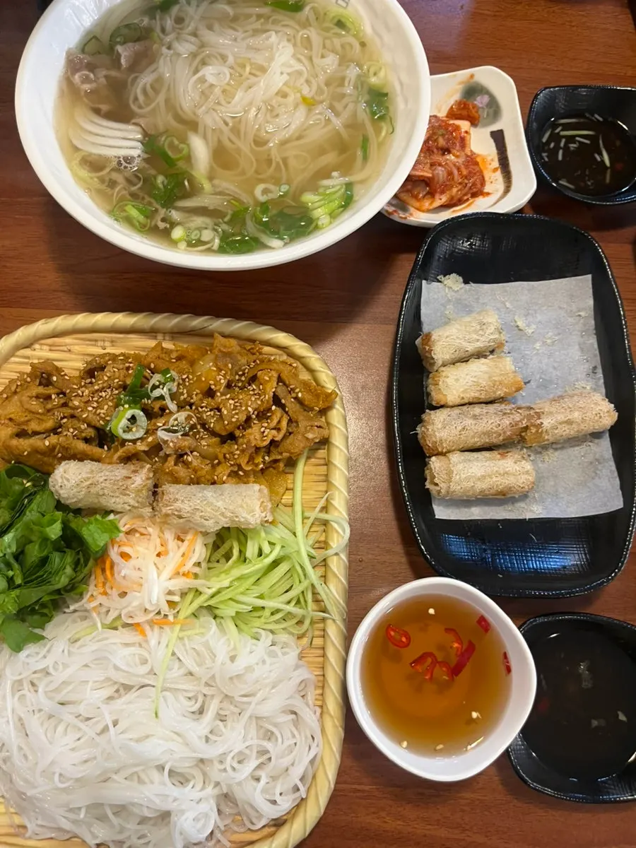 Lifting a bite of pho noodles