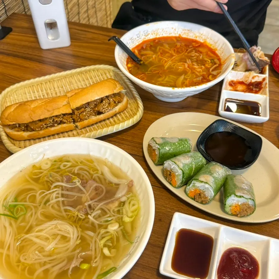 Phodam menu board listing banh xeo and bun cha