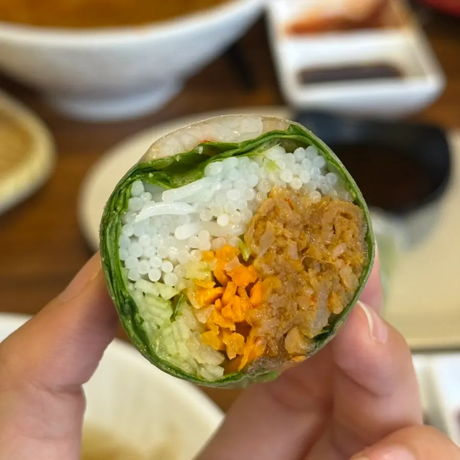Cross-section of a Phodam spring roll with shrimp and vegetables