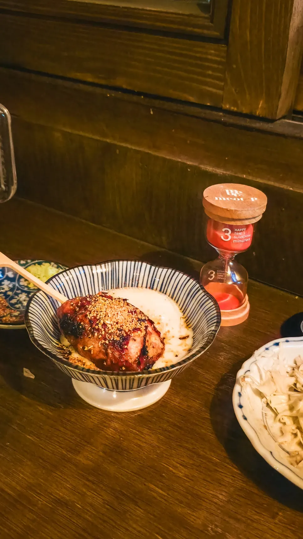 A skewer on a rabbit-shaped side plate topped with fresh wasabi