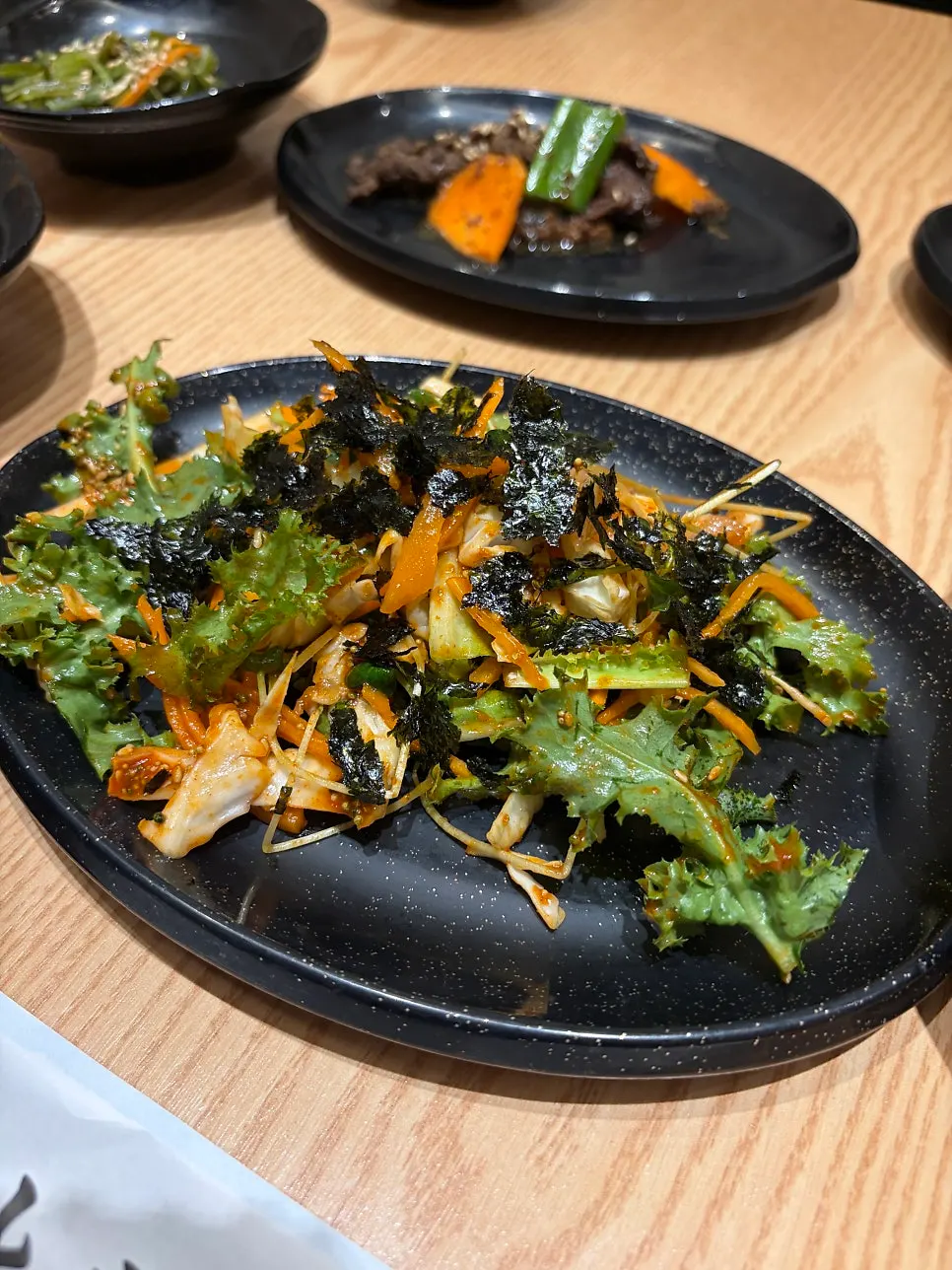Complimentary side-dish spread before the sushi