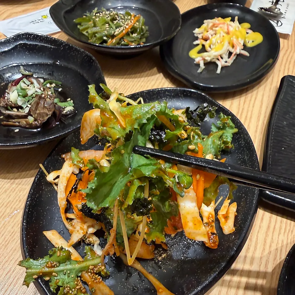 Spicy raw fish salad and soy-marinated crab in the complimentary spread