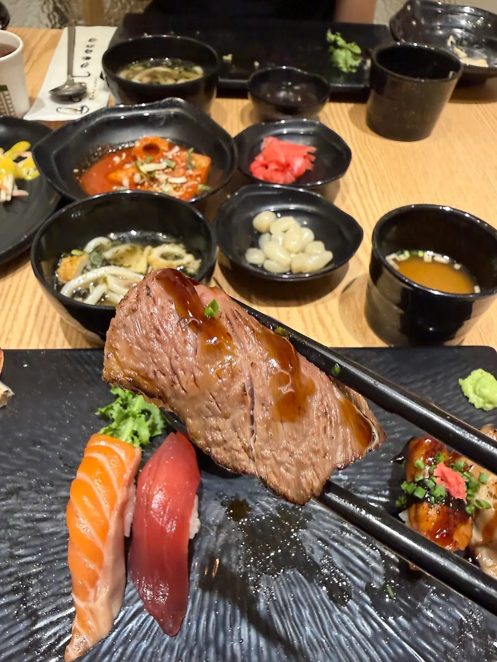 Large salmon sushi covering the rice