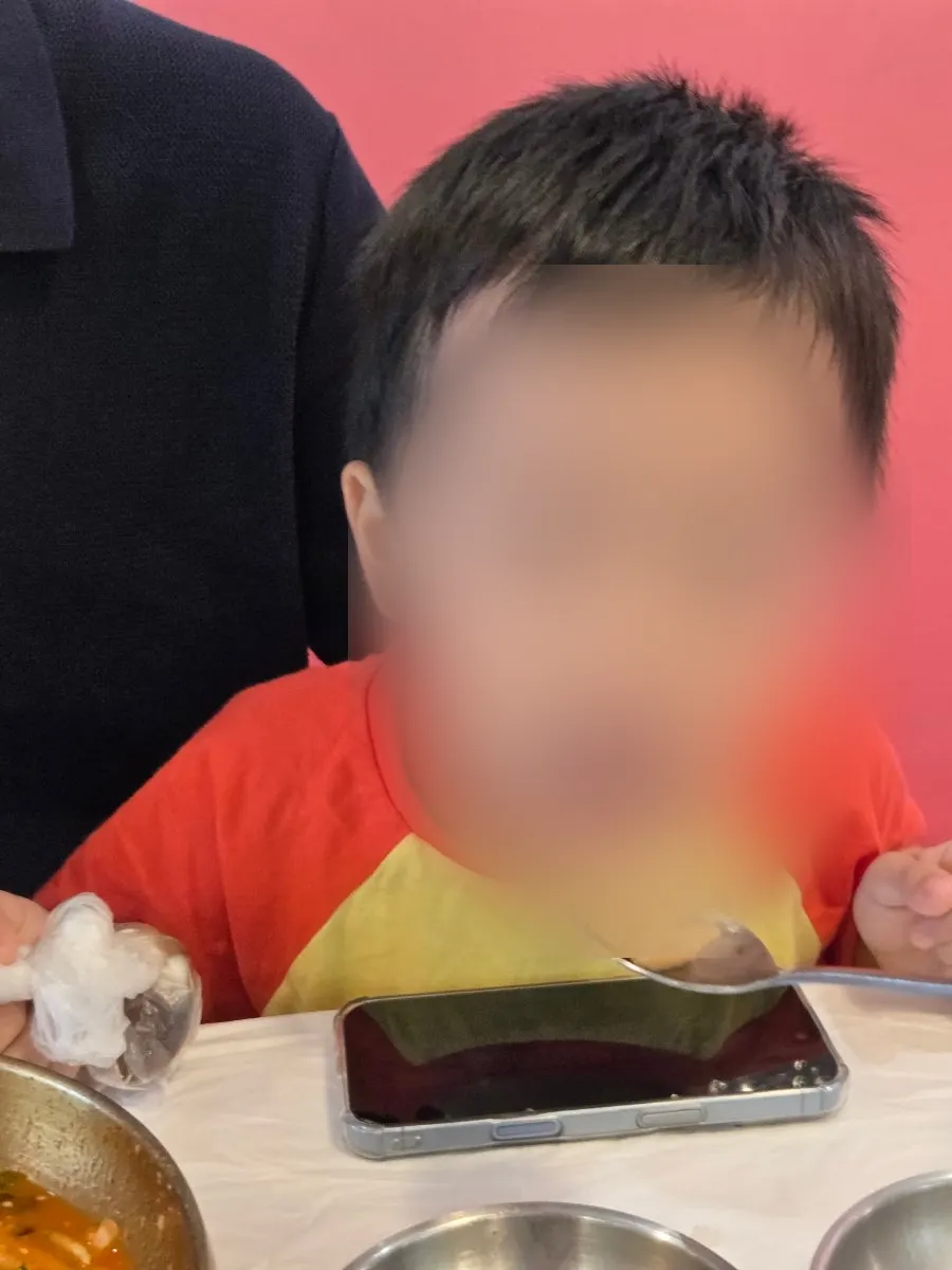 Chopsticks picking up a piece of tongsukhoe