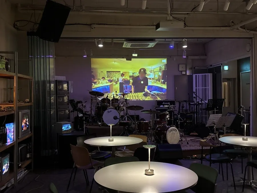 Performance stage with a drum kit and amp
