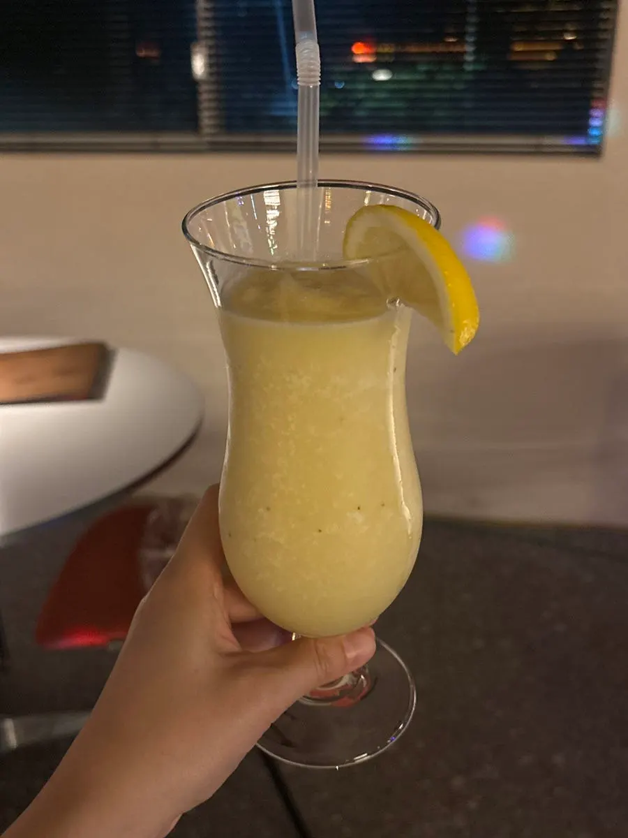 Non-alcoholic pina colada with a lemon slice