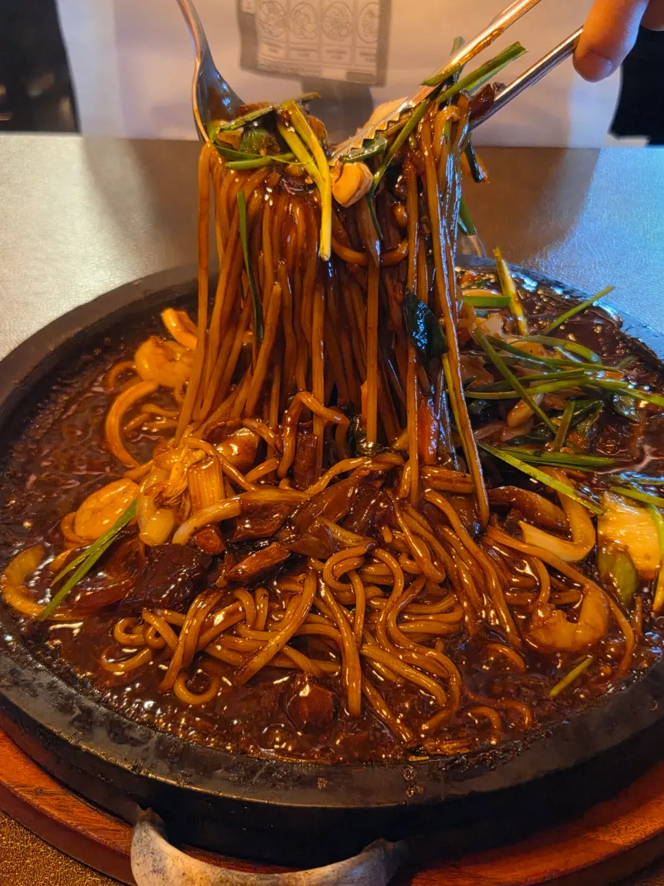 Mixed stone-plate jjajang with visible shrimp and squid