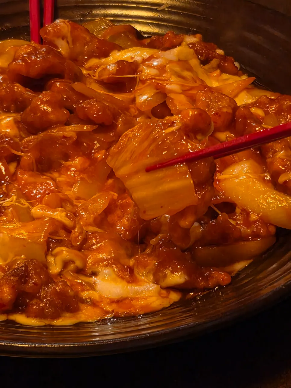 A stretchy cheese-topped piece of kim-pi-tang