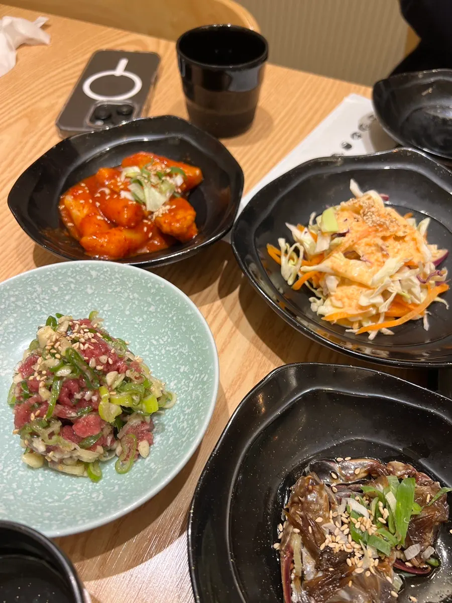 Full spread of banchan at Domo Sushi