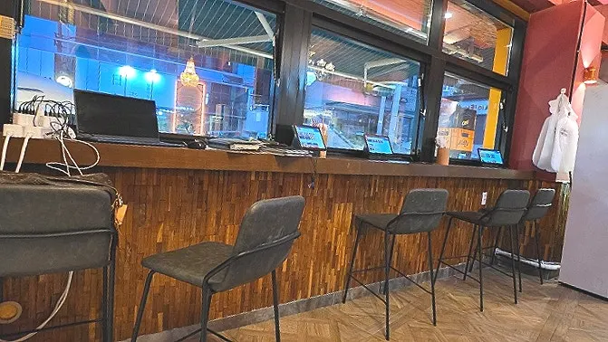 A corner of the restaurant lined with drinks that pair well with Chinese food