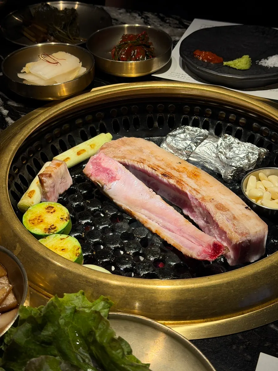 Close-up of pork belly cooking