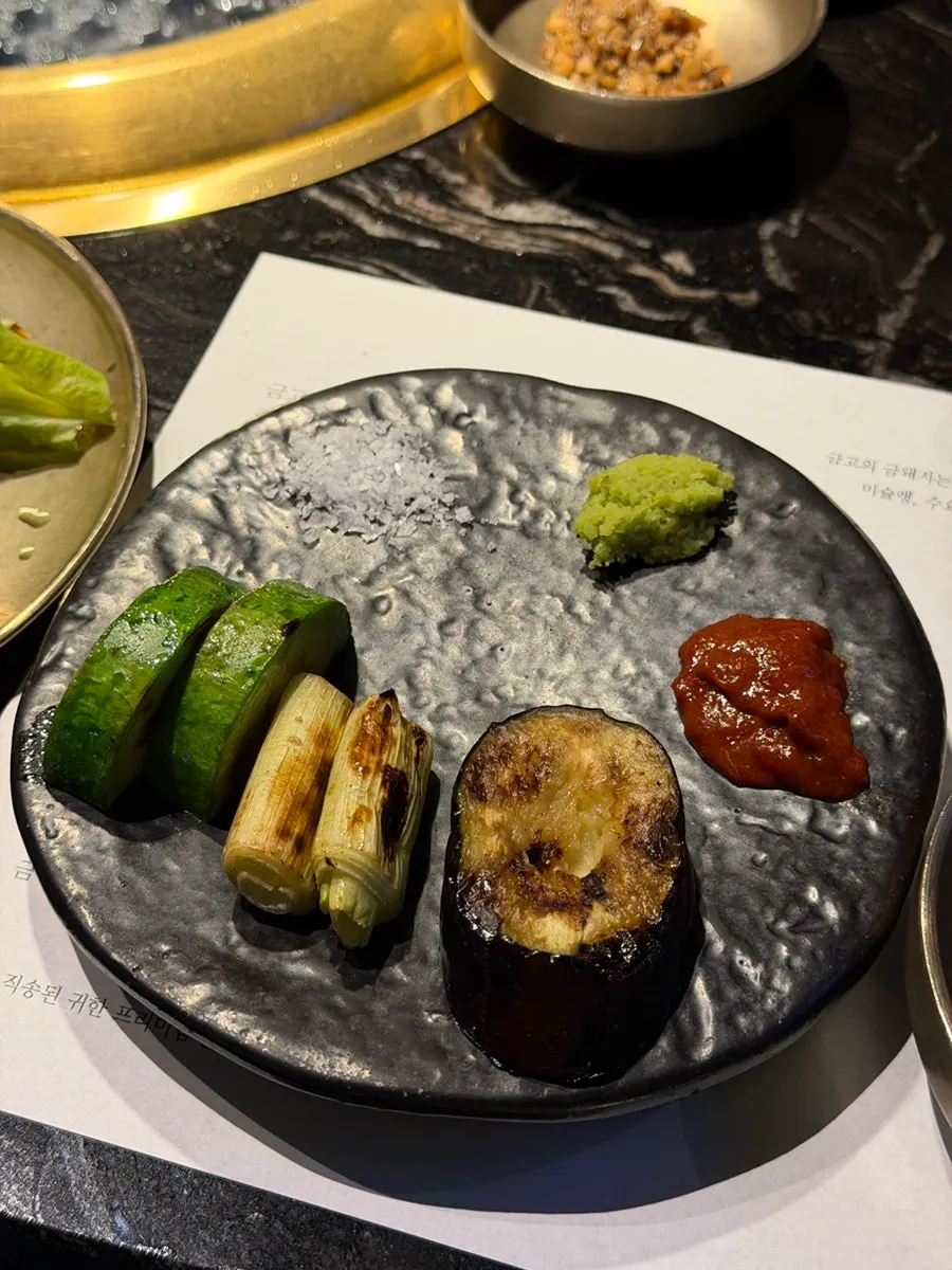 Vegetables grilling alongside the meat