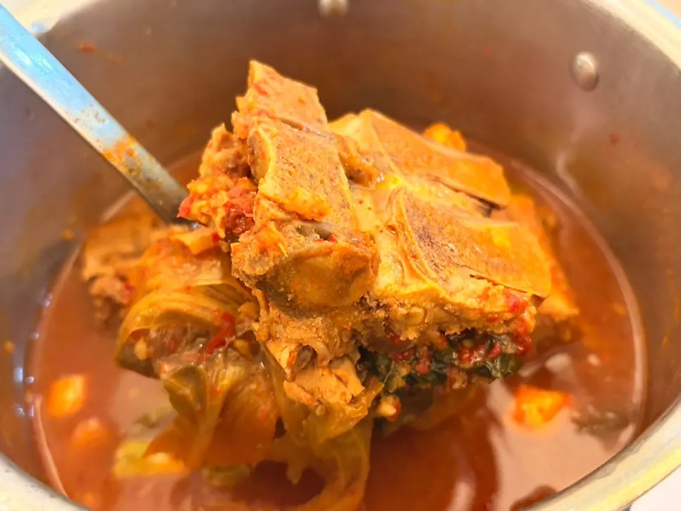 Complimentary hangover soup heated in a pot
