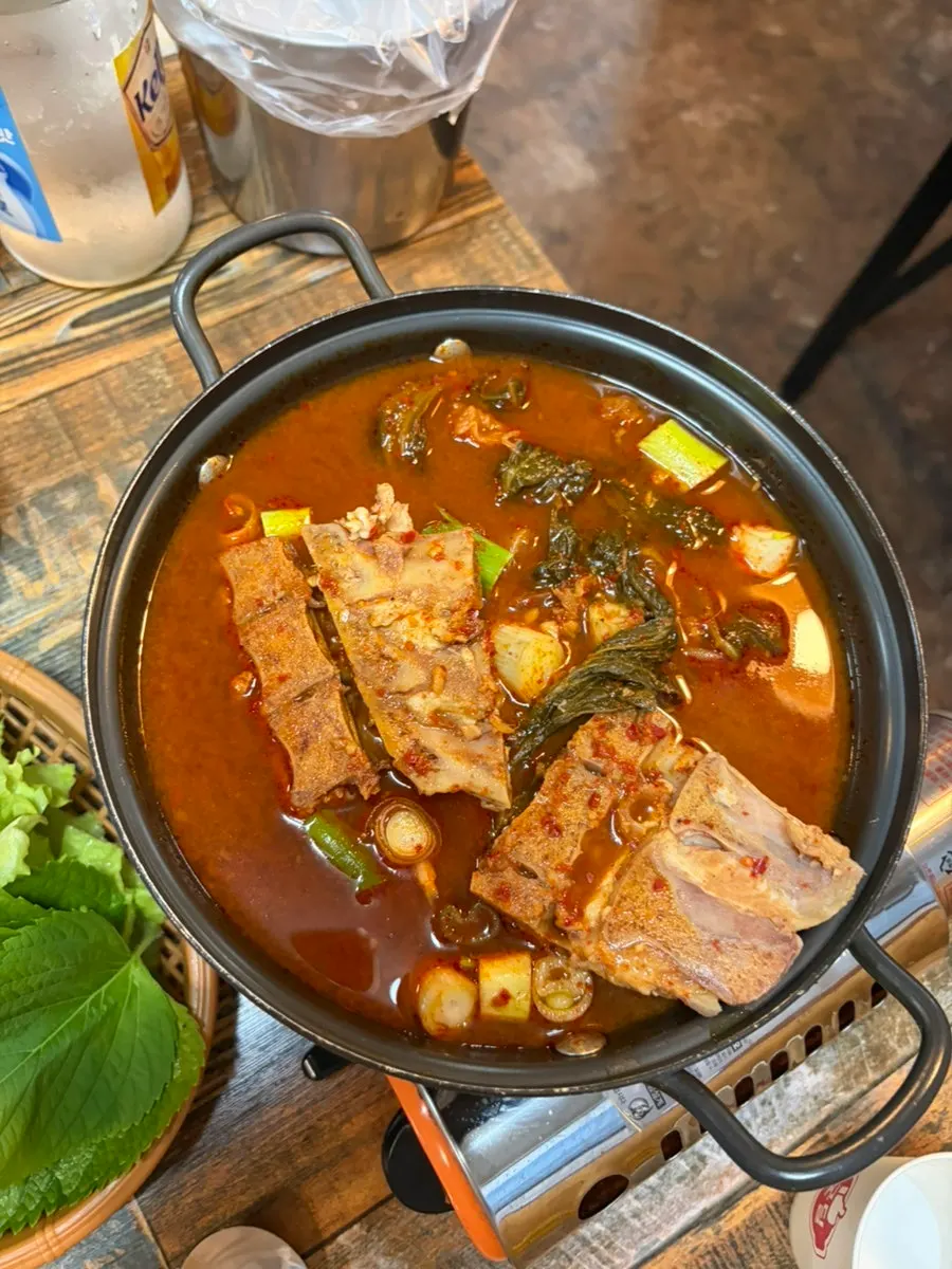 Table with remaining jokbal and side dishes