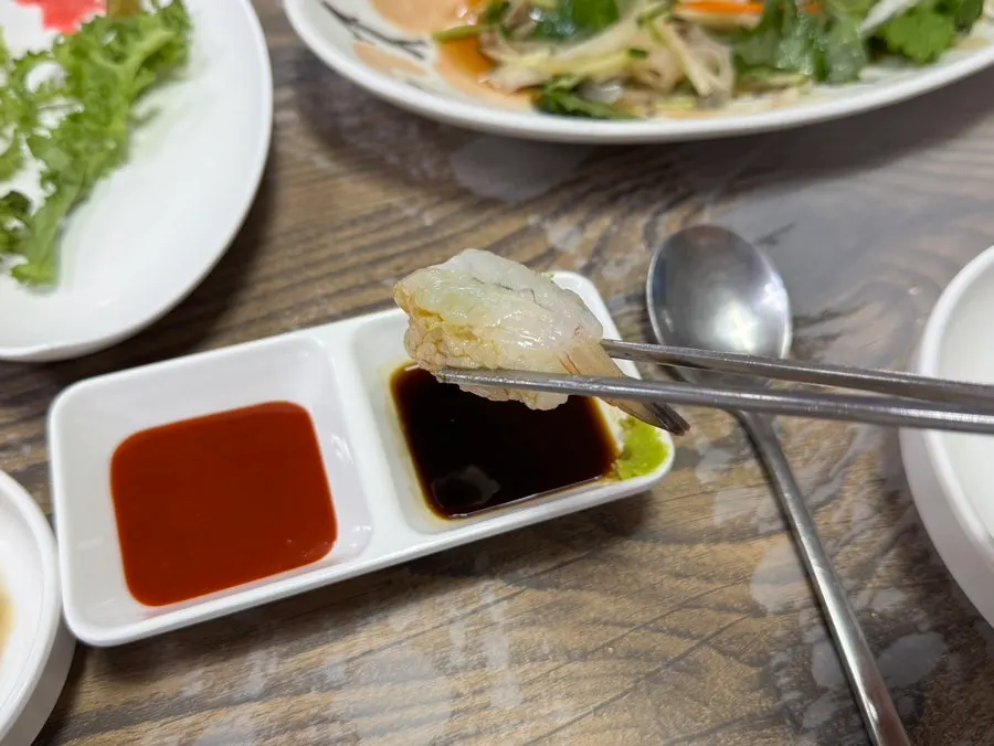 Seafood side dishes laid out on the table