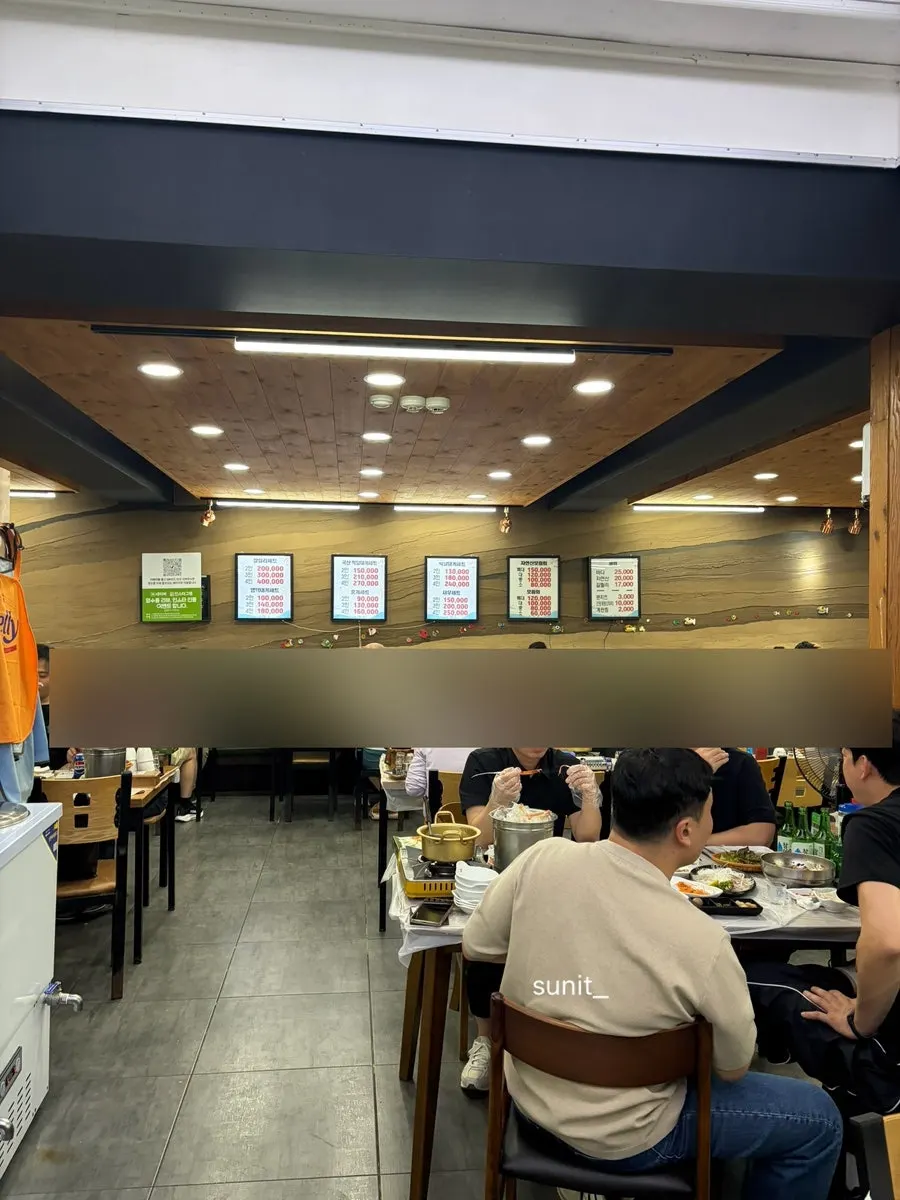 Table spread of the bakdal snow crab set for two at Gallilli Daegae Hoe Sikdang