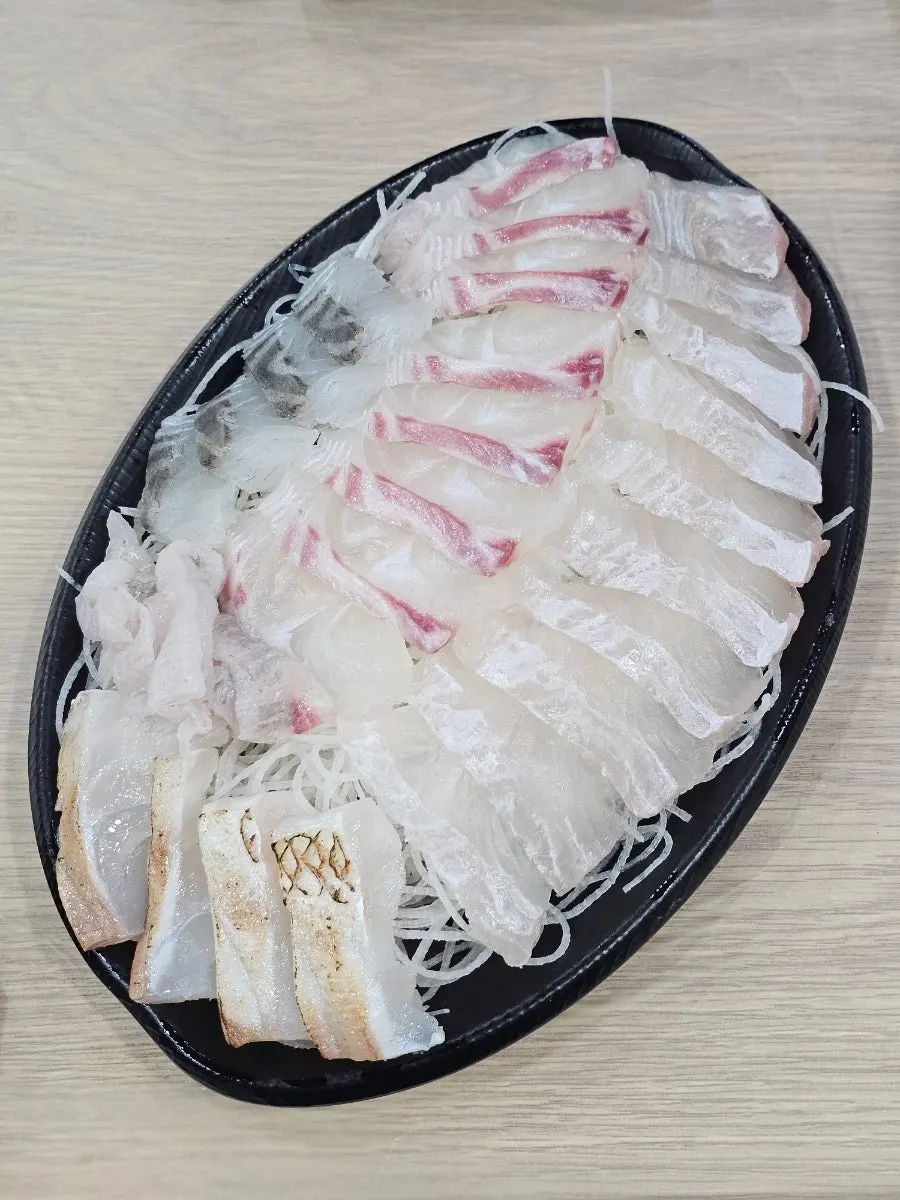 Plate of sea bass, red snorkel bream, and flounder sashimi