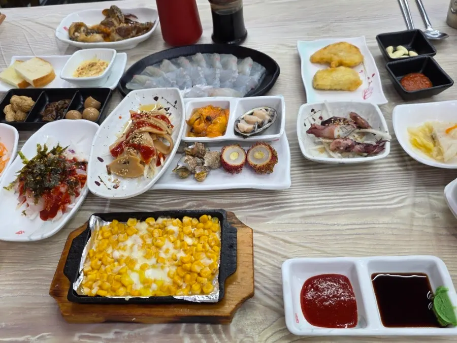 Basic side dish spread with seafood and corn cheese