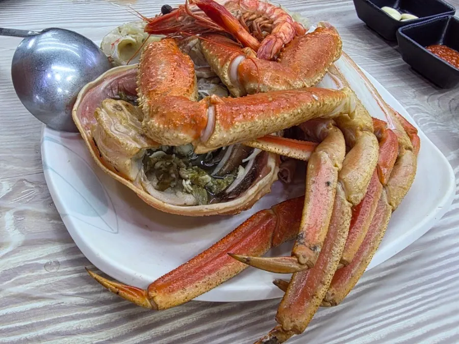 A plate piled full of bakdal snow crab legs