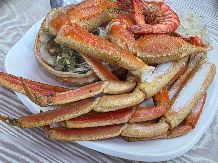Crab plate topped with shrimp