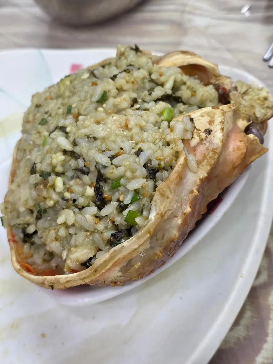 Crab roe bibimbap mixed with sesame oil and sesame seeds