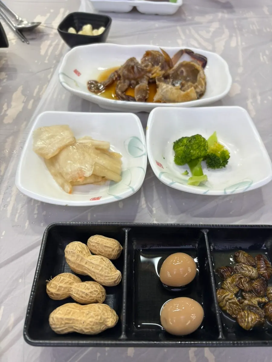 Side dishes including corn cheese and soy-marinated crab