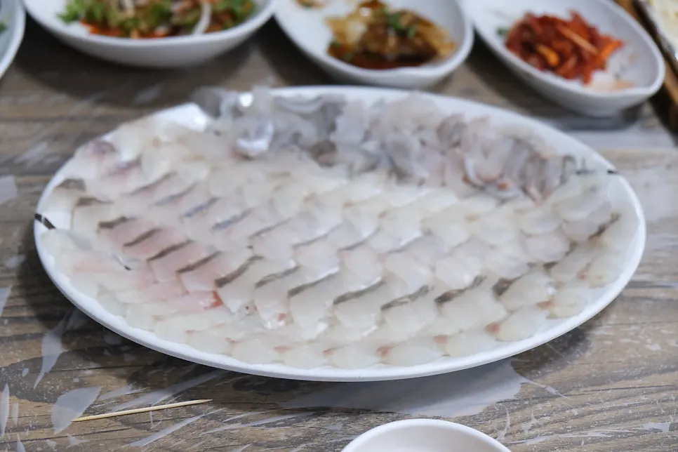 Table with sashimi and side dishes together