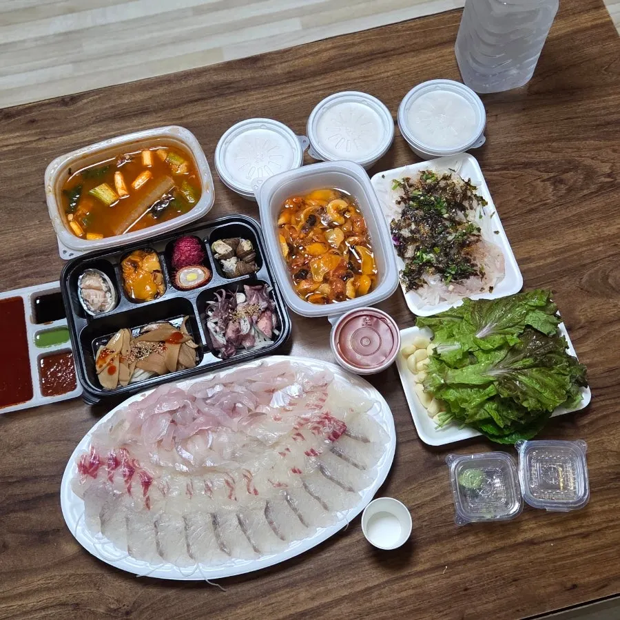 Sashimi laid out neatly on a wide plate