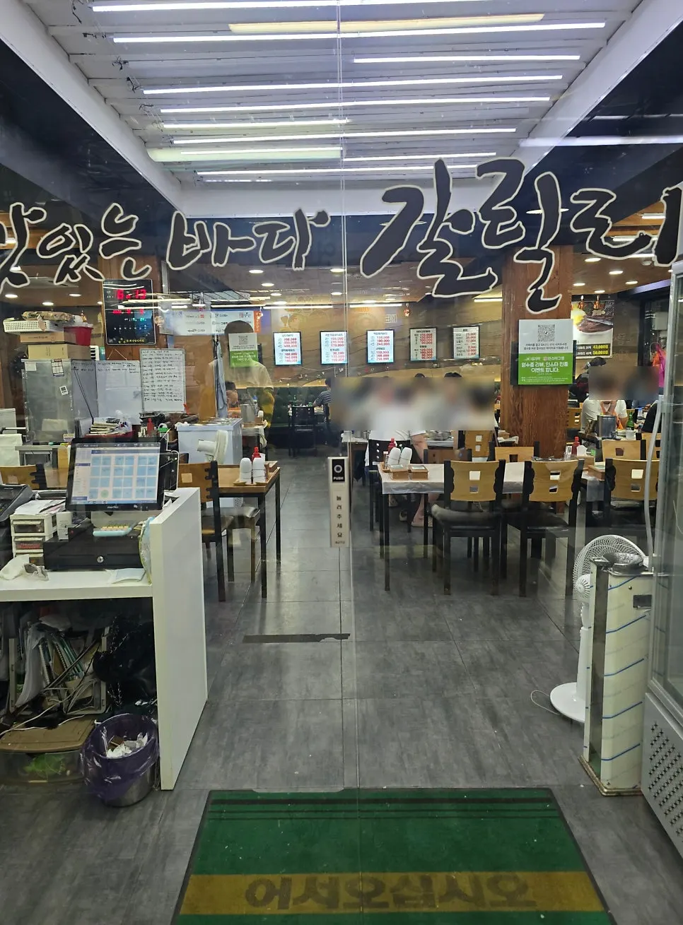 Spacious restaurant interior with many tables