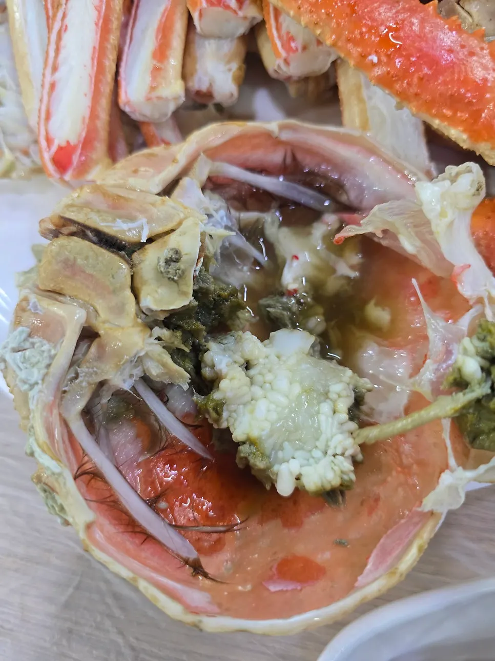Crab shell filled with roe and innards