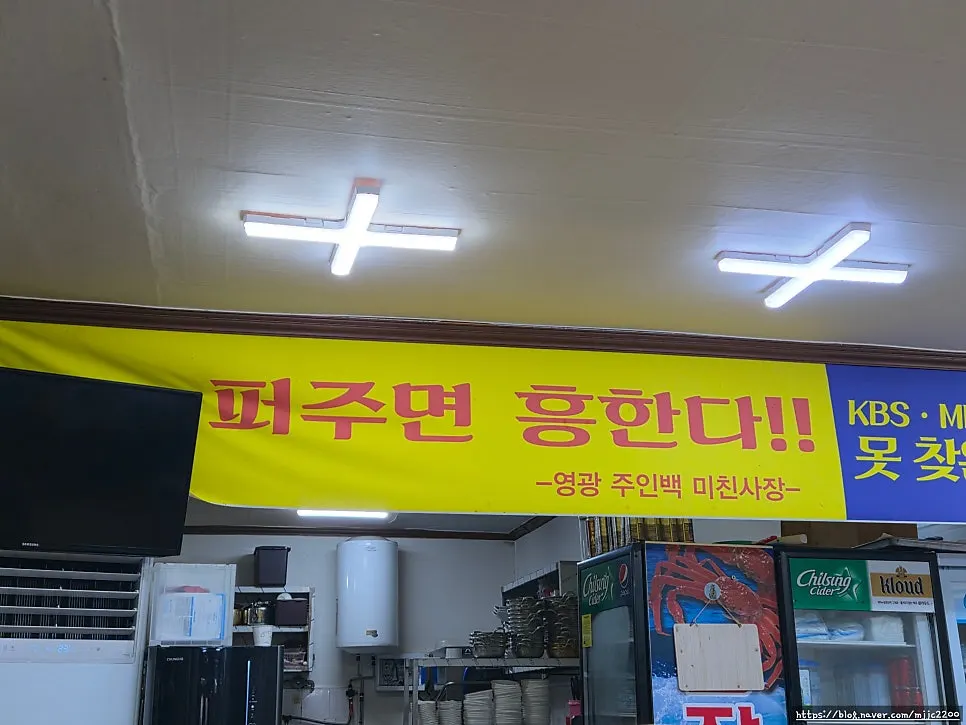 A table set with a large crab and seafood dishes