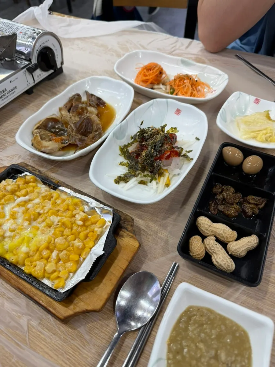 Corn cheese and hoe-muchim among the side dishes