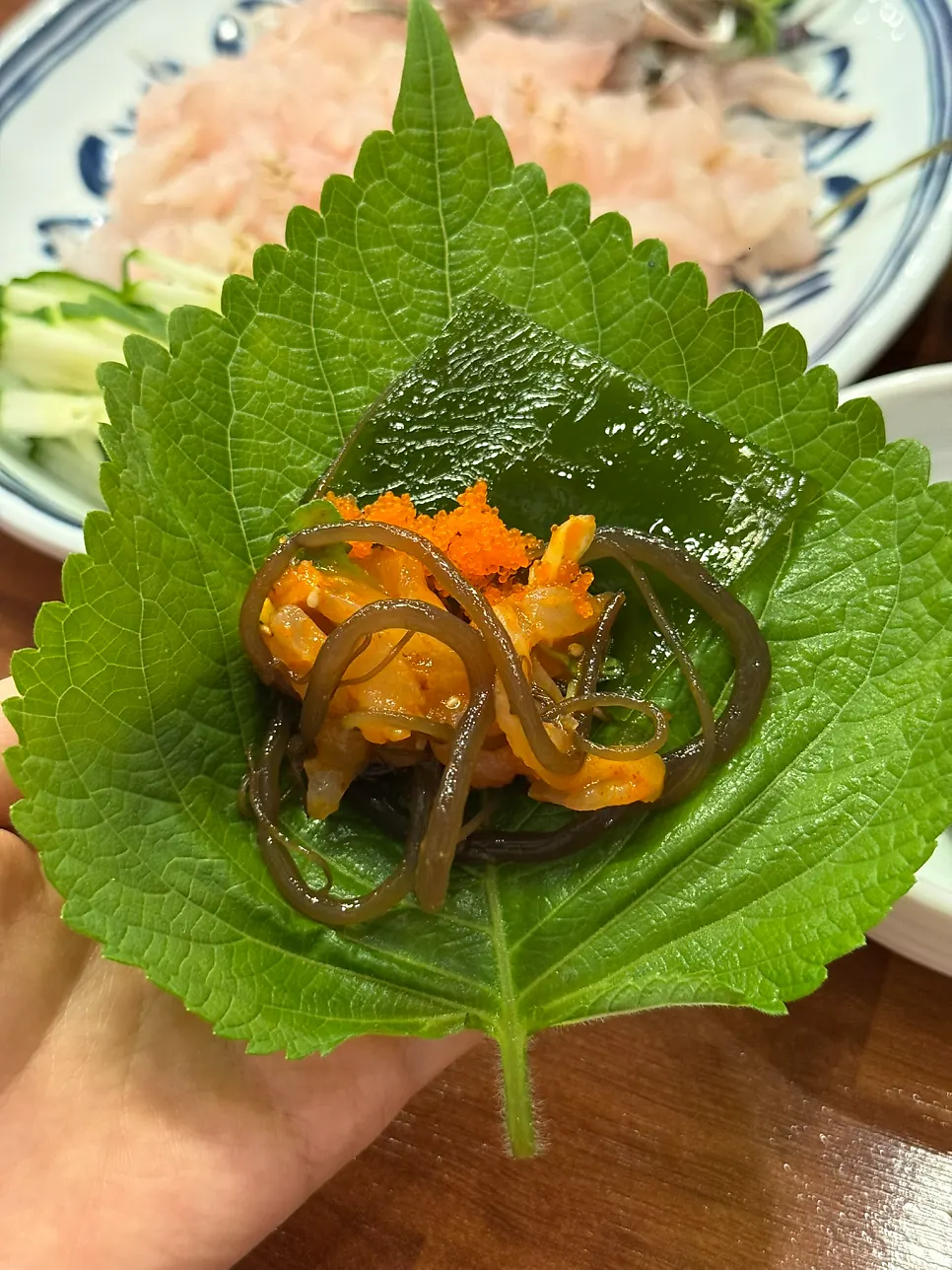 Tossed makhoe piled on a perilla leaf