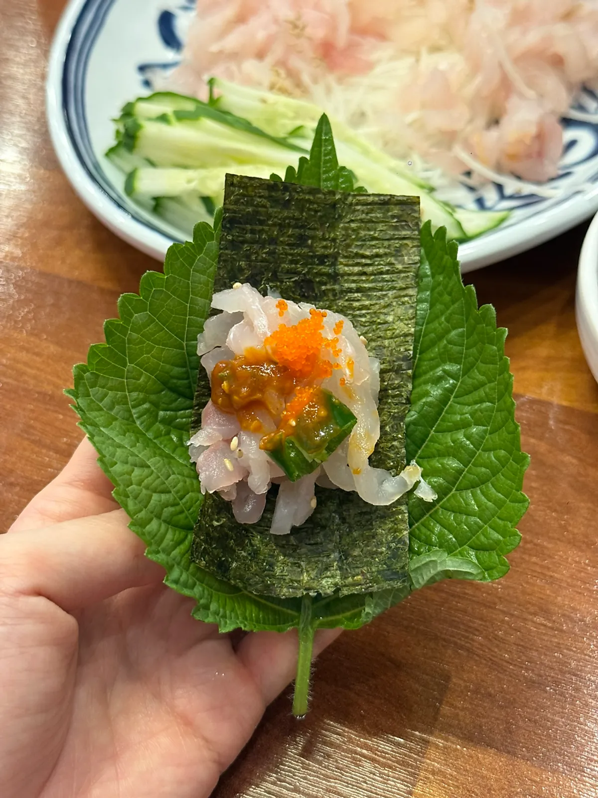 A bite-sized makhoe wrap topped with flying fish roe