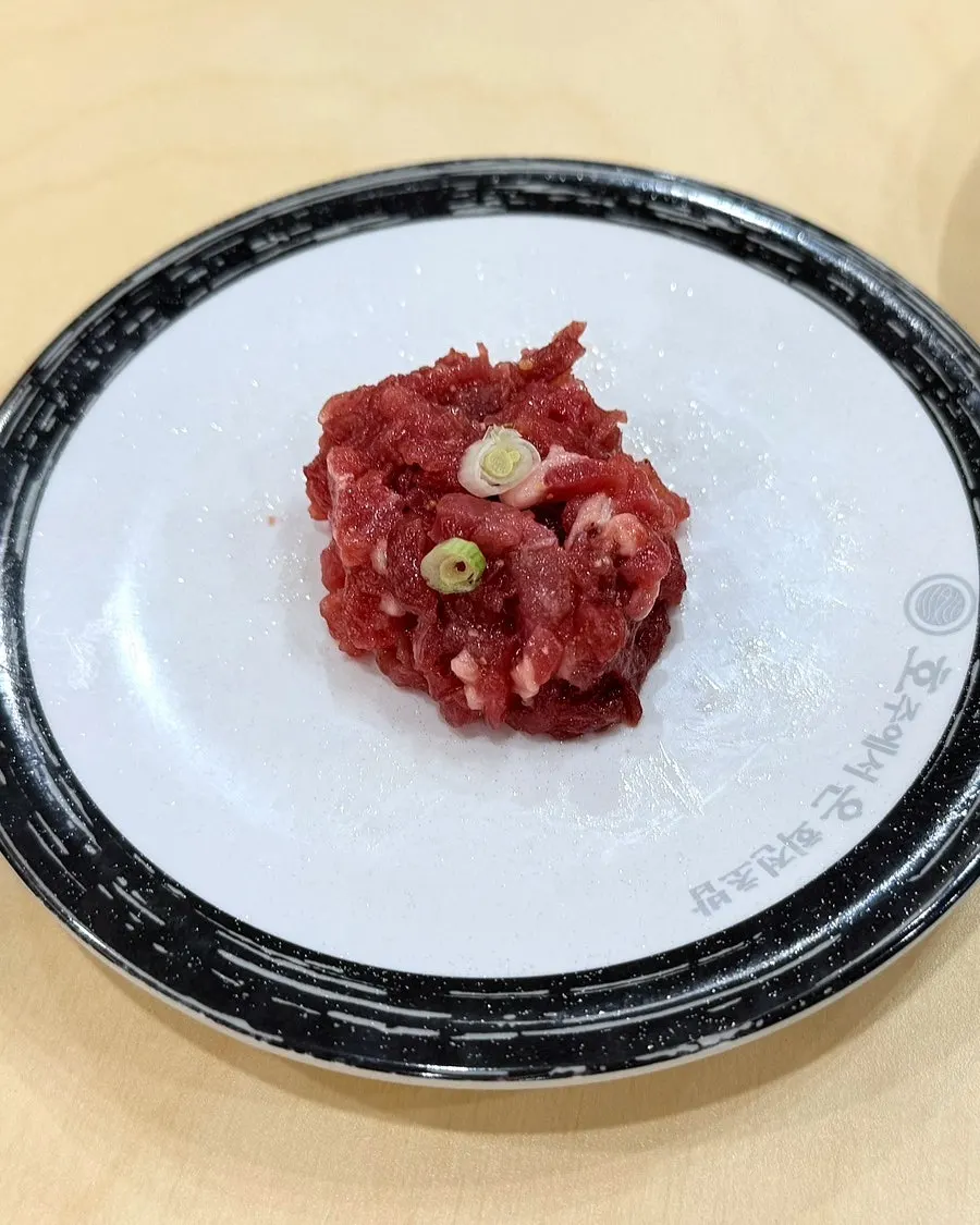 A plate of maki filled with fried shrimp