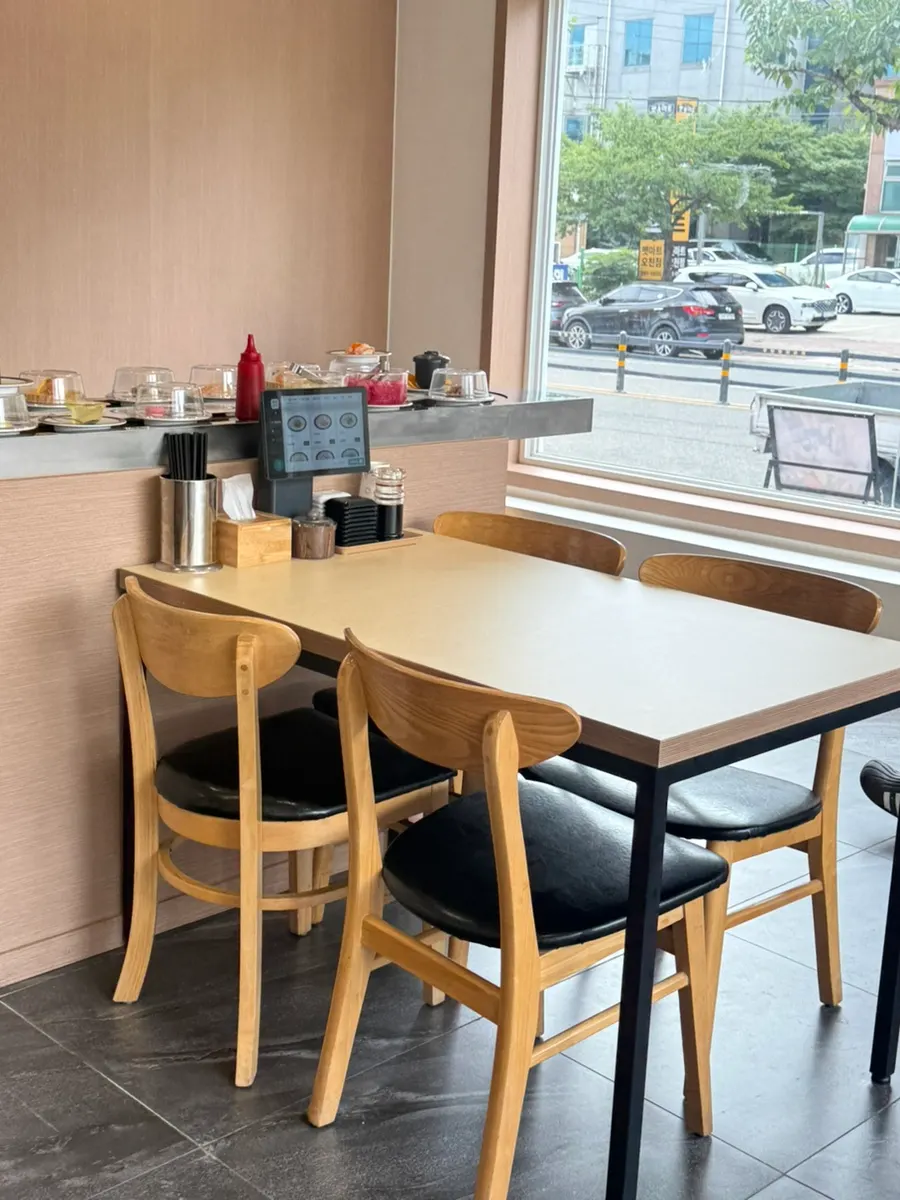 Seating inside the conveyor-belt sushi restaurant