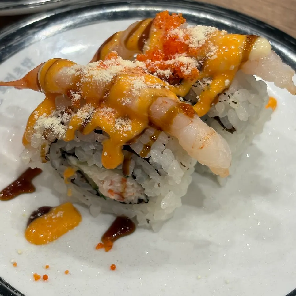 Conveyor belt with sushi and desserts