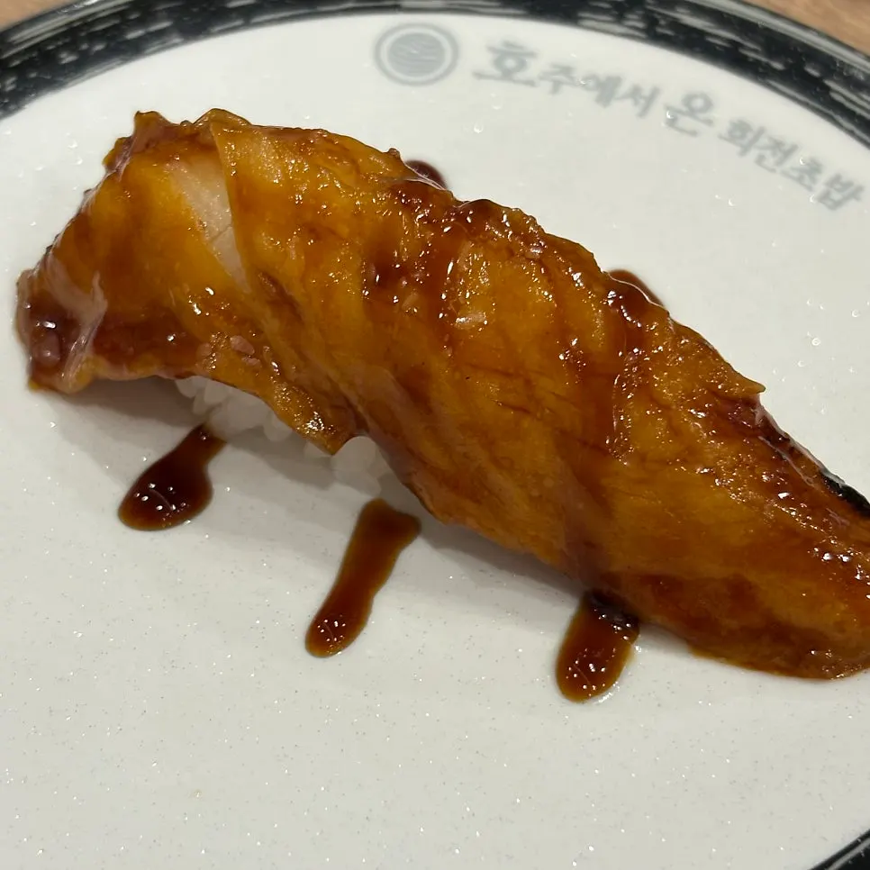 Various plates on the conveyor-belt sushi rail