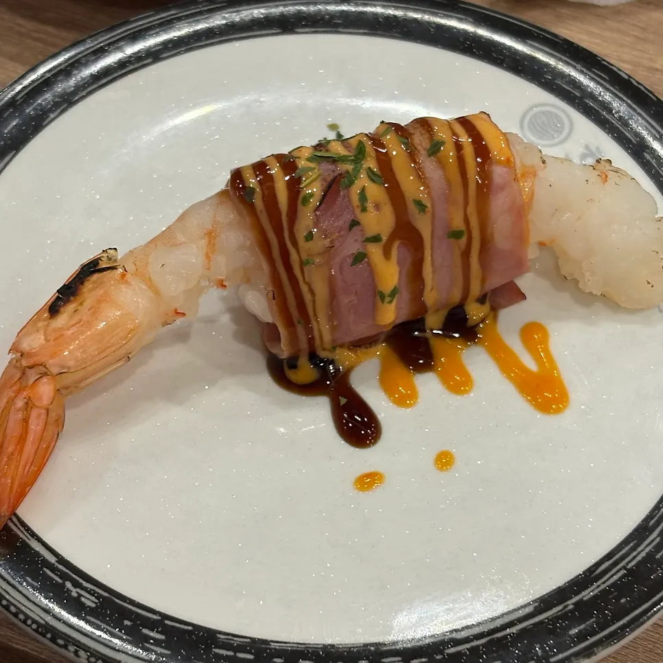 An assortment of conveyor-belt sushi plates