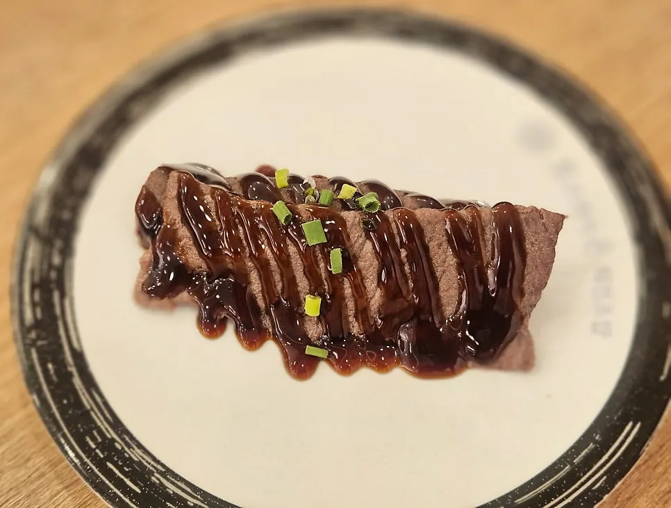 A plate of beef sushi
