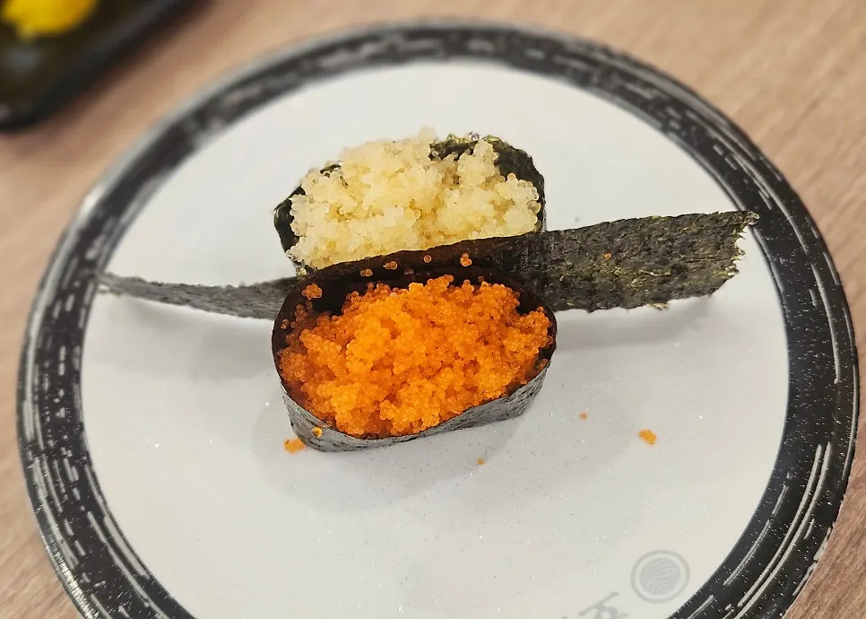 A plate of flying fish roe gunkan sushi