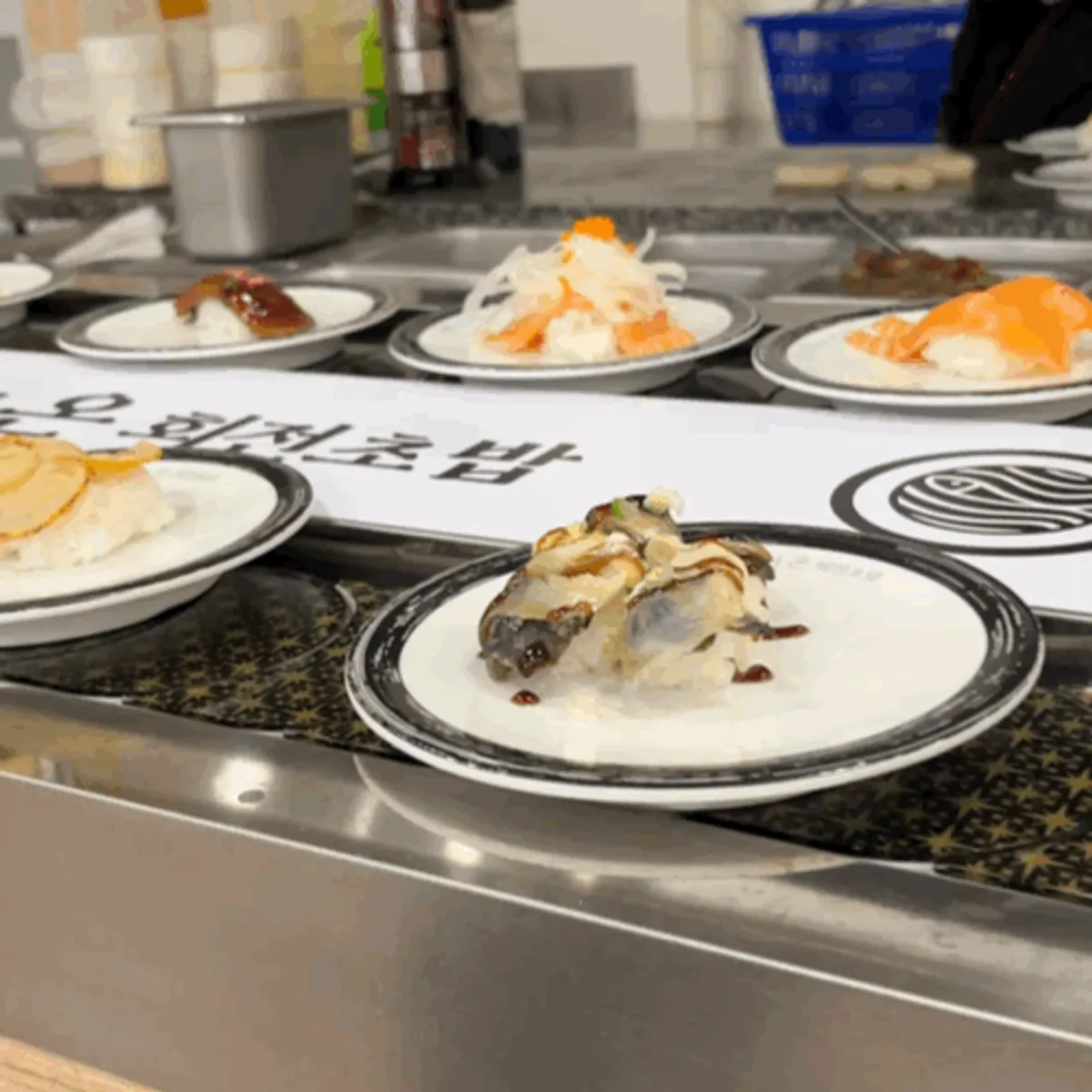 Conveyor sushi plates as the meal begins