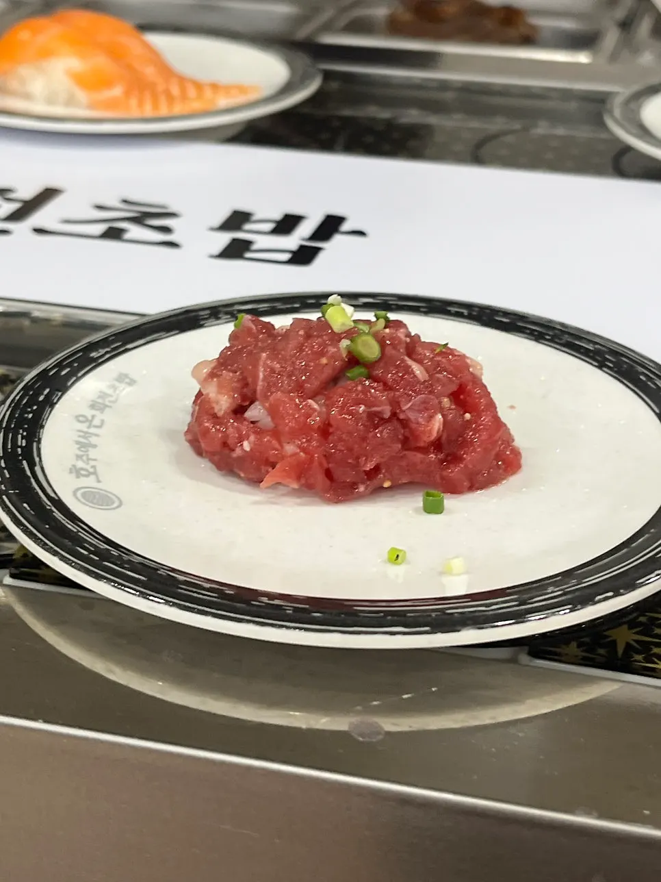 Various sushi plates on the belt