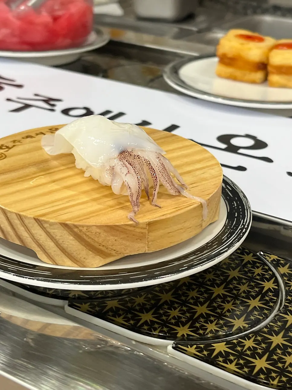 A separately ordered sushi plate delivered to the table