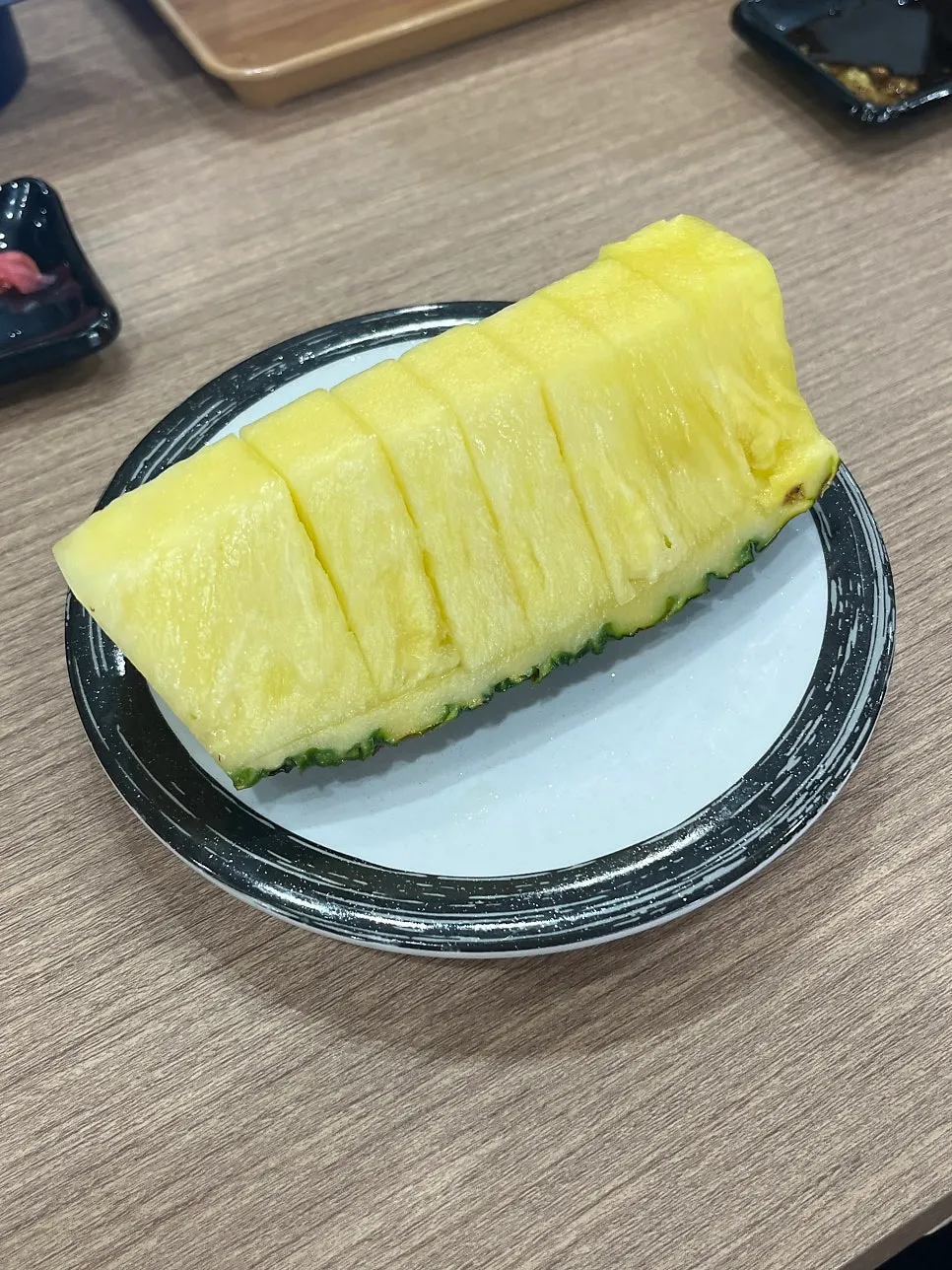 Large pineapple served for dessert